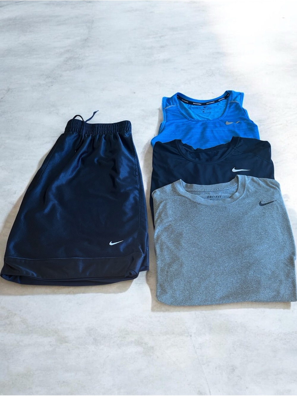Four Piece Nike Men’s Athletic Wear Tank, Black Tee, Gray Tee & Navy Shorts Set